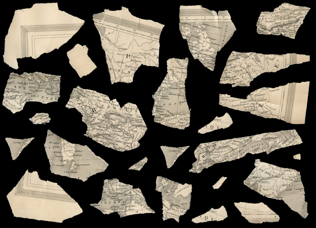 Decorative image: pieces of an antique fragmented french map against black