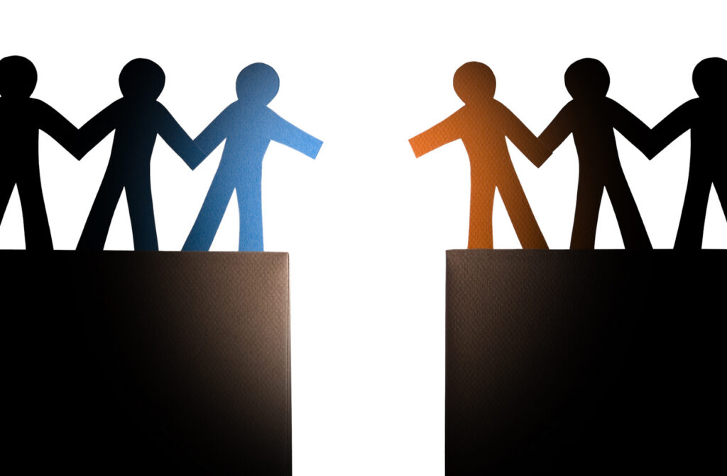 Decorative image of two groups of people approaching each other over a chasm, ready to shake hands.
