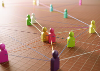 Decorative image representing the concept of communication with multi colored abstract people icons. (3d render)
