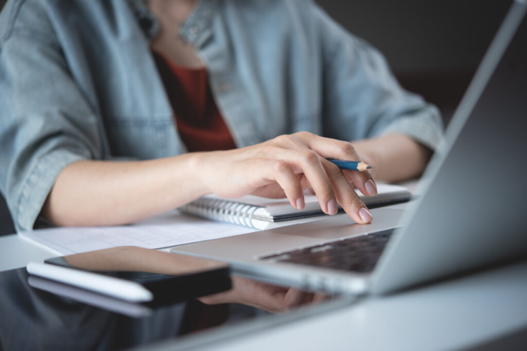 an author, working at their computer