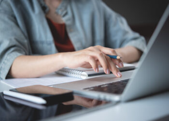 an author, working at their computer