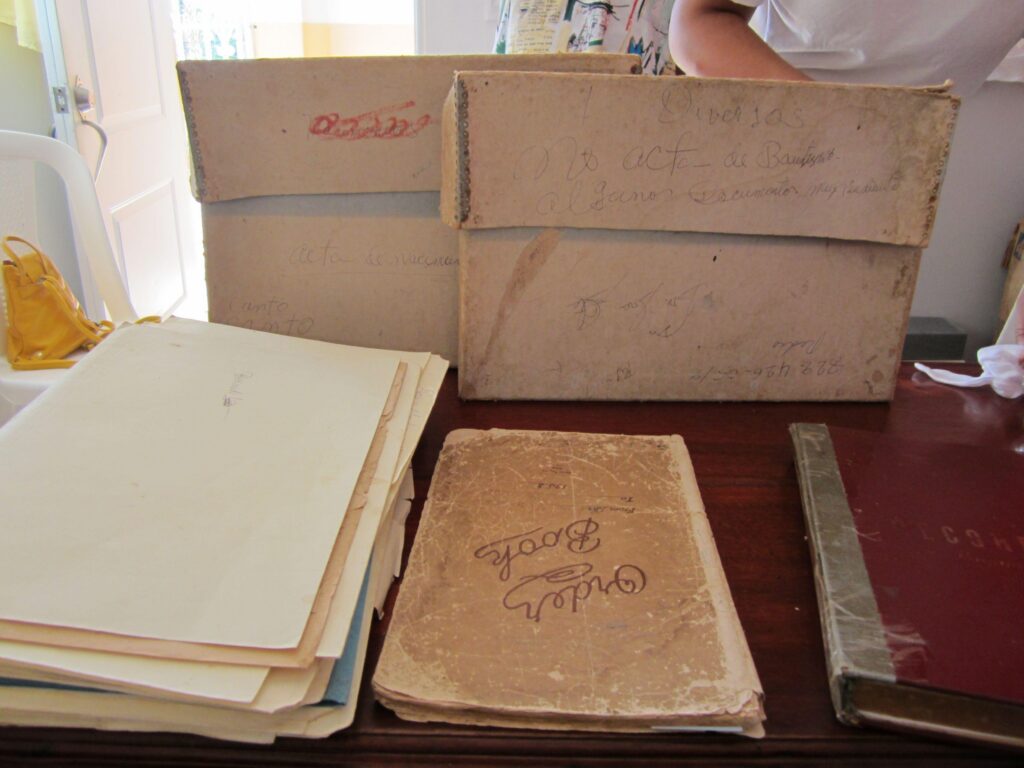 Pictured are the worn archival boxes used at the Mother Bethel AME Church before the conservation and digitizing phase.