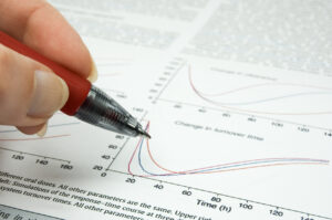 Decorative image of female hand holding hand over scientific article