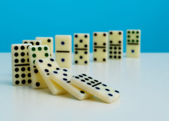 Decorative image of Dominoes falling in a row