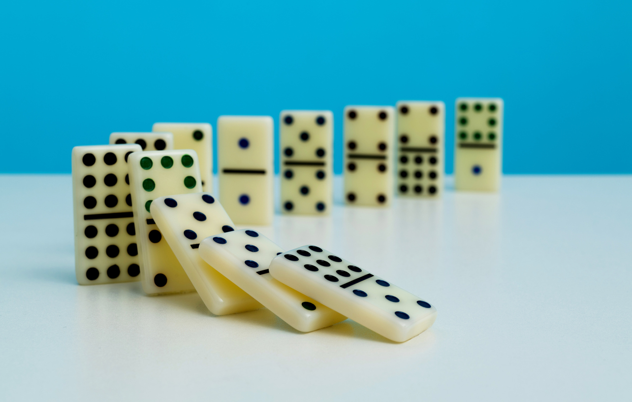 Decorative image of Dominoes falling in a row